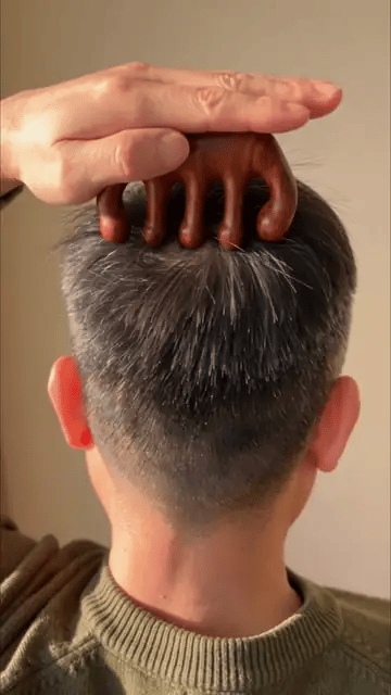 Using the HairGuard wooden scalp massager on the crown